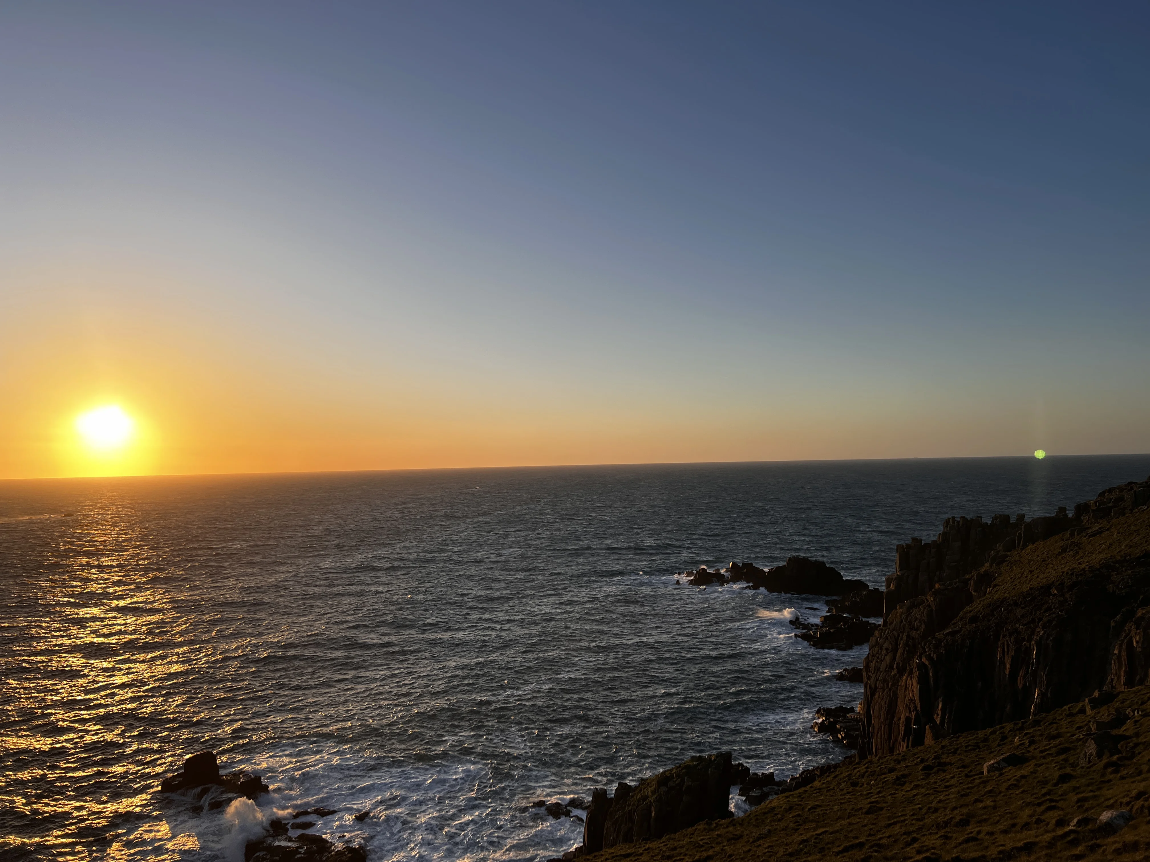 The sunset of Lands End, cliffs and waves